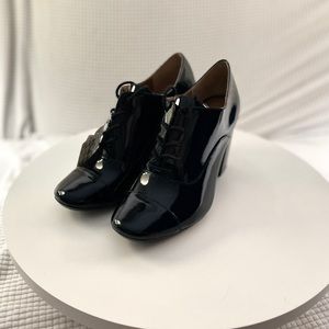 Calvin Klein black patent leather Oxford Booties. NWT. Size 6.